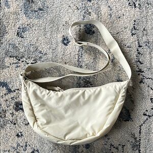 NWOT Cream Uniqlo Crescent Bag